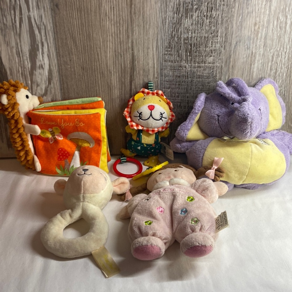 Lot of baby rattles .book and elephant playing a song plush
